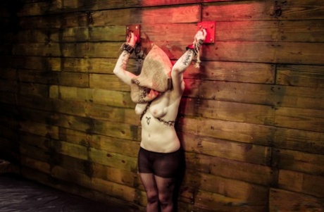 Suicide girl Jynx Hollywood is dominated by a couple of lesbians in a dungeon