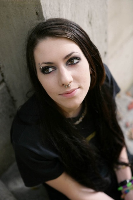 Brunette teen smokes in a stairwell prior to giving a blowjob