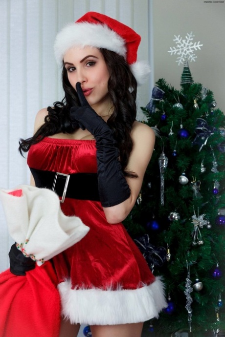 Amateur model Katie Banks sets her round tits free of Santa attire at Xmas