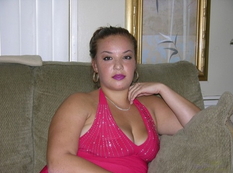 Amateur BBW Brittany K slips off her red dress to model totally naked at home