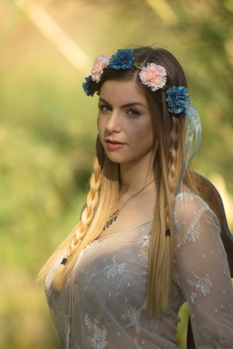 Sweet solo girl takes off her summer dress wearing a crown of flowers