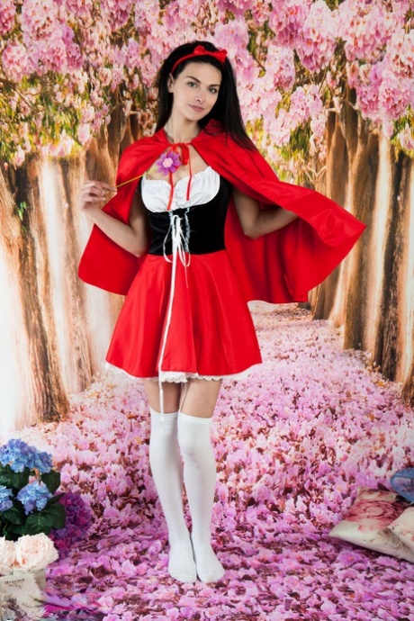 Dark haired teen girl strips off red hiding hood outfit & over the knee socks