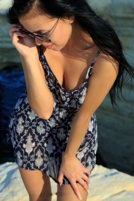 Dark haired girl Venice Lei confidently shows her lithe figure at the beach