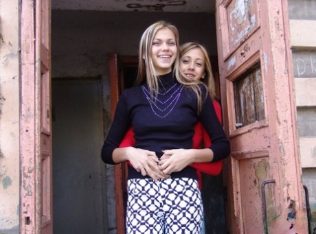 Young lesbians Laura & Katrina hump each other while fully clothed outdoors