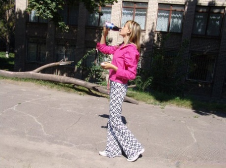 Young blonde flashes her tits and ass while out in public places