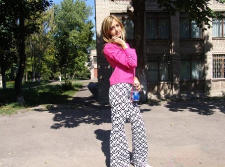 Young blonde flashes her tits and ass while out in public places