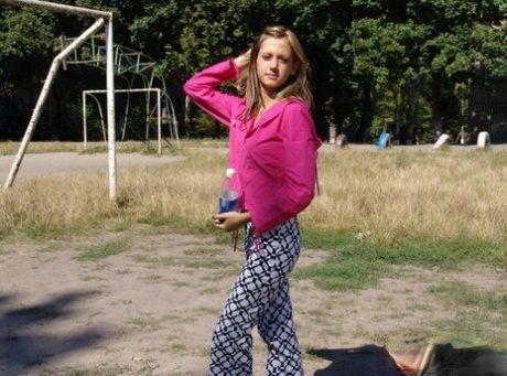 Young blonde flashes her tits and ass while out in public places