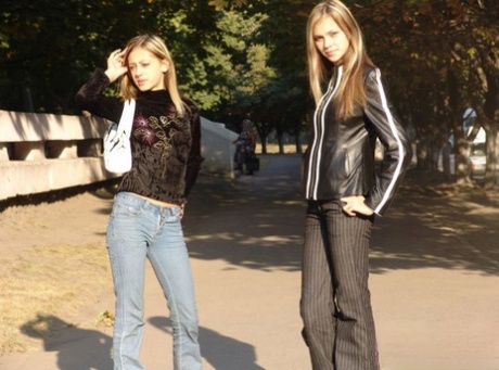 Teen lesbians Katrina and Laura hold hands while clothed in public