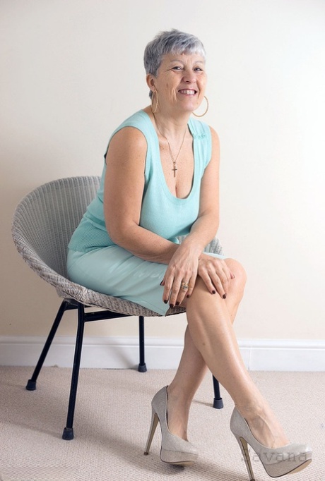 White granny Savana flashes no panty upskirts before exposing a big breast