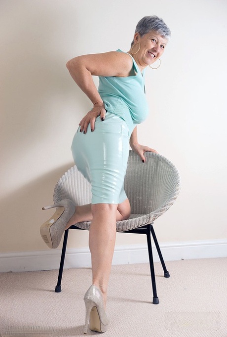 White granny Savana flashes no panty upskirts before exposing a big breast