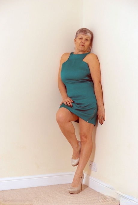 White granny Savana flashes no panty upskirts before exposing a big breast
