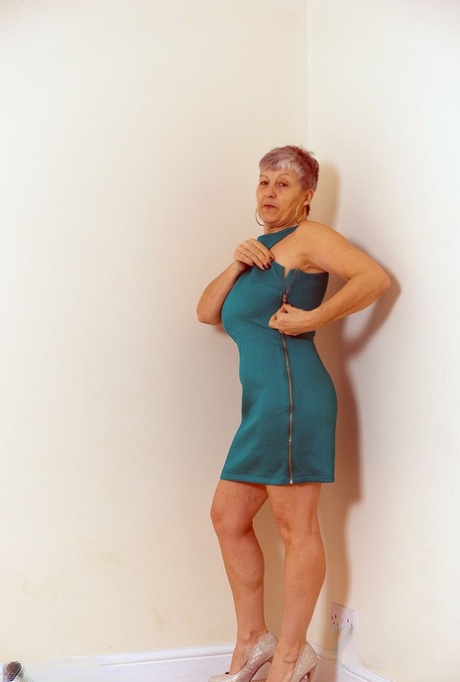 White granny Savana flashes no panty upskirts before exposing a big breast