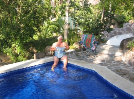Fat nan Girdle Goddess goes for a skinny dip in a backyard pool - pornpics.de