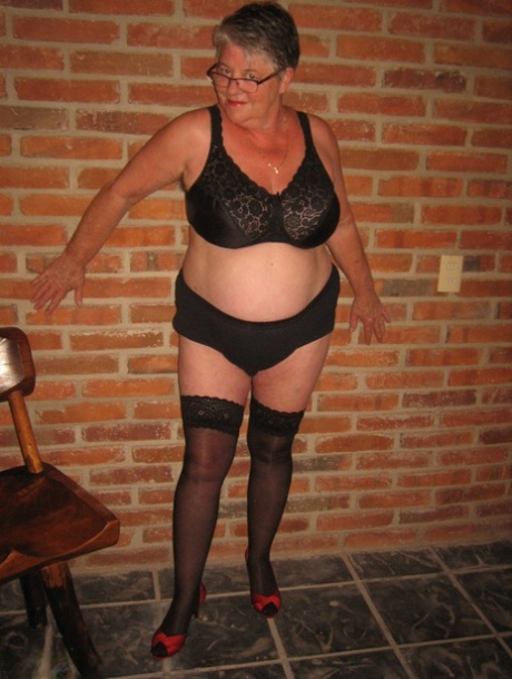 Fat old woman strips to black stockings and heels with her glasses on - pornpics.de