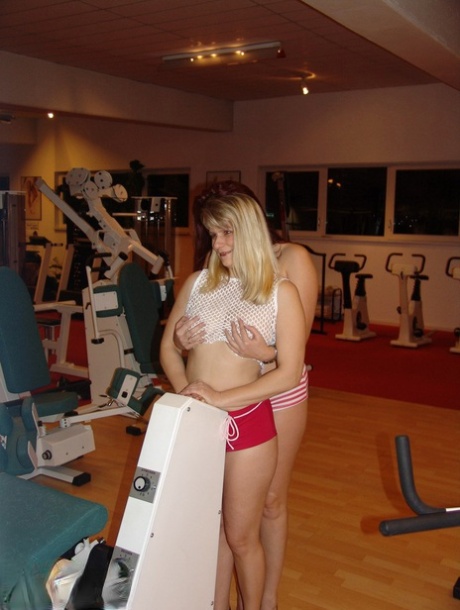 Blonde amateur Sweet Susi & her lesbian girlfriend go topless on gym equipment
