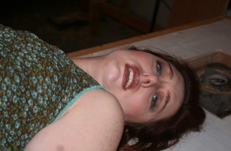 Clothed woman has her tits exposed while tied up and gagged with ropes