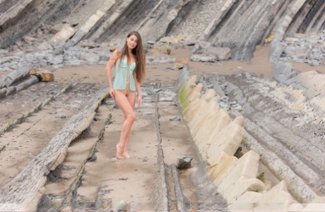 Beautiful teen Lorena G removes baby doll lingerie at low tide