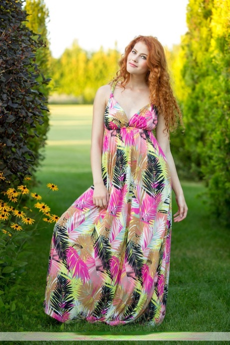 Beautiful redhead Heidi Romanova removes long dress for nude poses on the lawn - pornpics.de