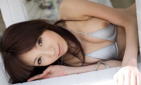 Pretty Japanese girl Kanako Tsuchiya removes her dress to model nude in heels - pornpics.de