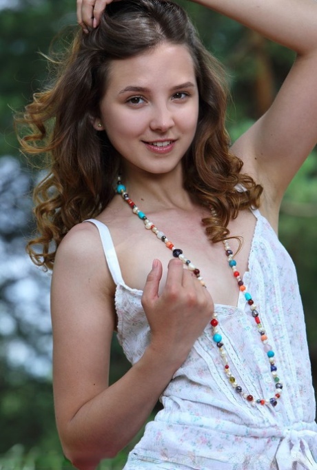 Adorable teen Ava showcases her bald twat on picnic blanket by the woods