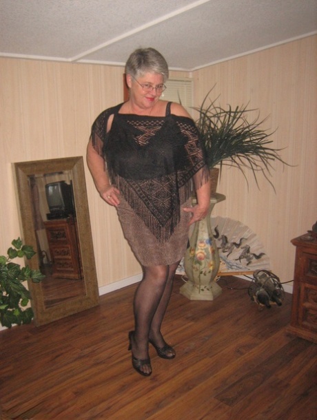 Fat granny unleashes her huge breasts before flashing no panty upskirt