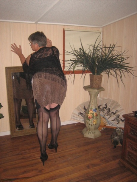 Fat granny unleashes her huge breasts before flashing no panty upskirt