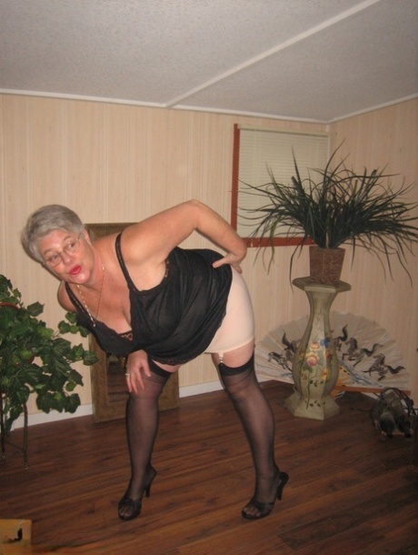 Fat granny unleashes her huge breasts before flashing no panty upskirt
