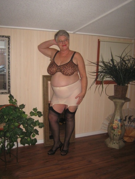 Fat granny unleashes her huge breasts before flashing no panty upskirt