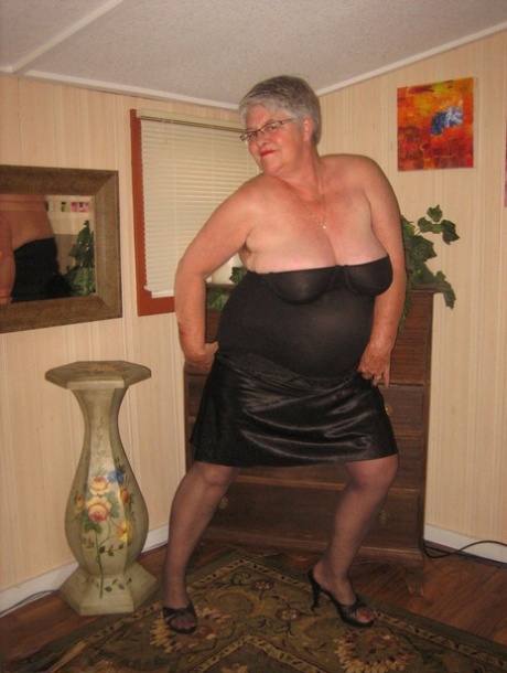Fat old woman Girdle Goddess doffs black lingerie to pose nude in stockings