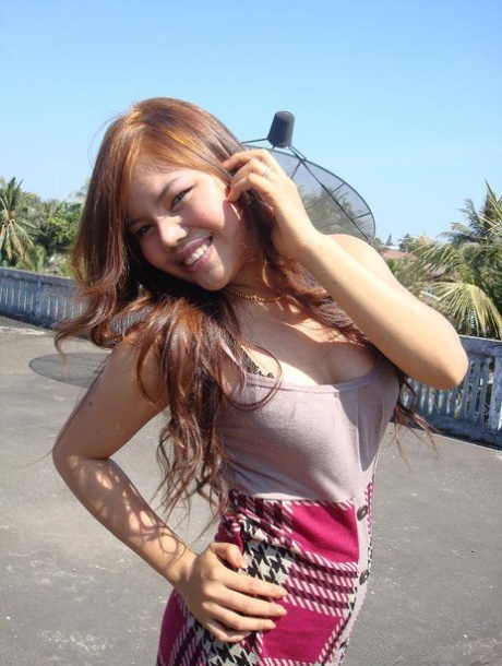 Asian girl is nothing more than a cock tease as she goes about her daily life