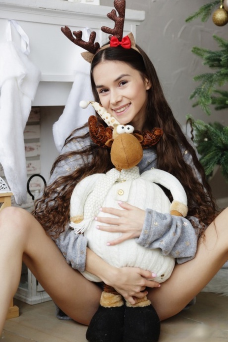 Adorable teen Leona Mia shows her thin body wearing deer antlers and socks - pornpics.de