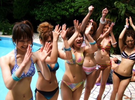 Japanese girls suck the jizz from cocks during a BJ competition by the pool