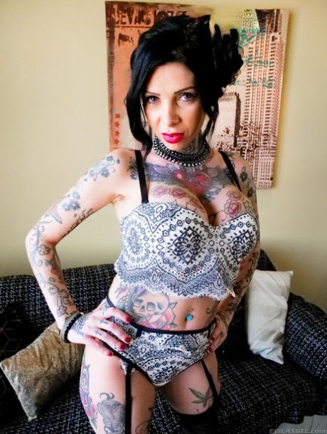 Tattooed chick Megan Inky sports cum on her face after a double penetration
