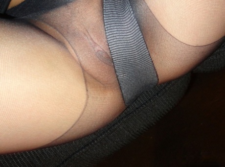 Nice teen Andi Land exposes her tits and pussy while wearing sheer pantyhose