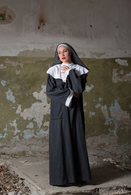 18 year old nun Judith Able removes her clothing to model naked