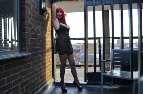 Older redhead Barby Slut exposes herself while wearing black lingerie - pornpics.de