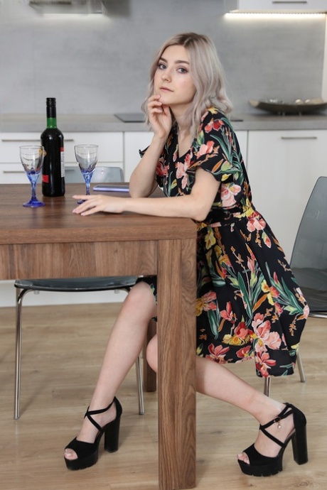 Amateur girl Eva Elfie gets totally naked after drinking wine at kitchen table