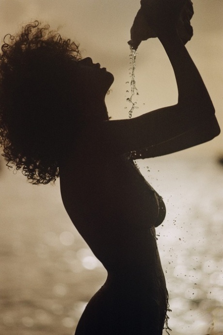 Ebony model Nereyda Bird strikes hot poses at the beach for Playboy