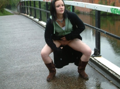 British chick with a shaved pussy pisses on a bank a railed walkway - pornpics.de