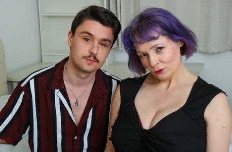 Aged lady with purple hair and big tits sucks and fucks her toy boy