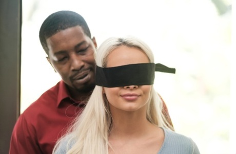 Hot girl Elsa Jean is freed from a blindfold prior to her interracial fucking