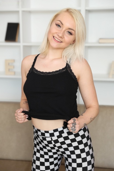 Young blonde Marilyn Sugar pleasures her tight pussy with sex toys