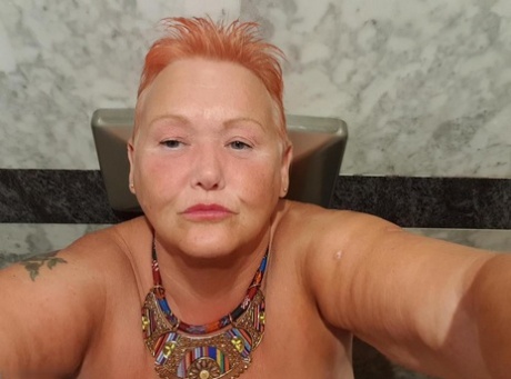 Fat granny with red hair Valgasmic Exposed takes naked selfies at home