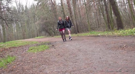 2 redheads squat for a piss while taking a walk on a dirt road