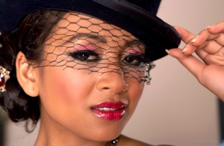 Asian model Kina Kai dons a top hat to show her twat in black stockings
