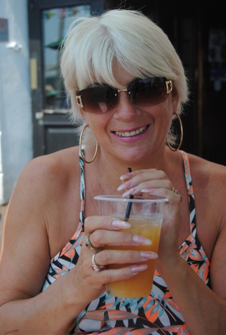 Older platinum blonde Dimonty flashes in public places on a warm day - pornpics.de