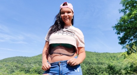 Chubby teen Sofia Lee frees her big natural tits from a bikini in the outdoors