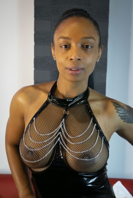 Ebony model Alicia Rhodes poses in a see-through top and over the knee boots - pornpics.de