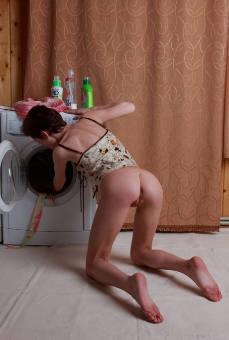 Skinny teen with short hair Stefania gets totally naked atop a washing machine