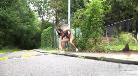 Solo girl Isabel Dark lets loose with a stream pf piss on a public sidewalk